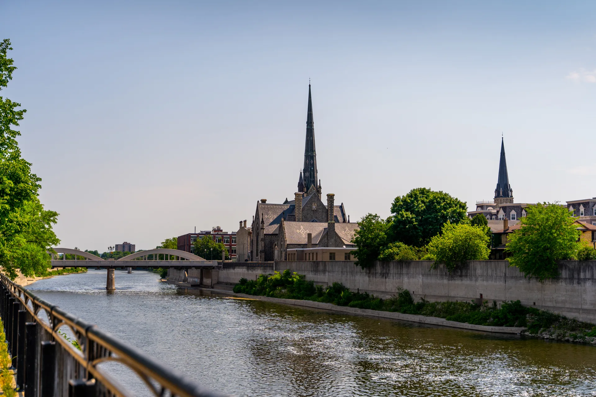 The Grand River in downtown Galt, Cambridge, with the Central Presbyterian Church spire and the Main Street bridge